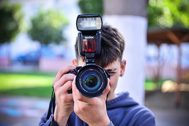 Man taking a photograph representing NPNC
